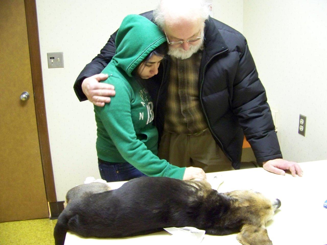 Craig comforting Roxana at the death of her beloved beagle mix Garrison, February 2011