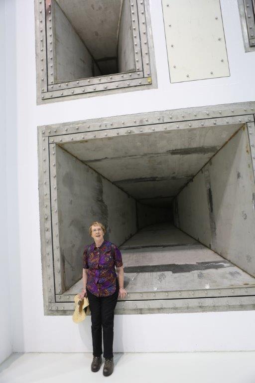 me standing in front of one of the giant woofers in the world's largest/loudest reverb acoustic test chamber at NASA Plum Brook