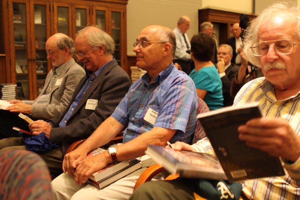 everyone happily examining their doorprize books